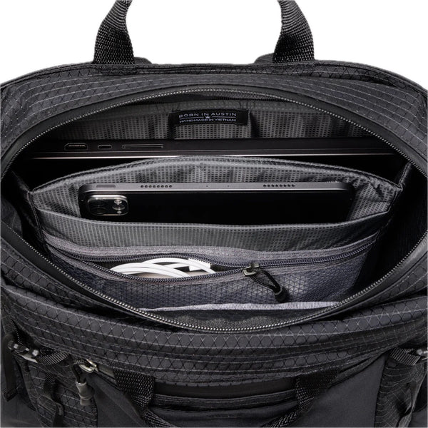 Gossamer Gear Vagabond Jet V2 – laptop compartment open with tablet, phone, and charging cable