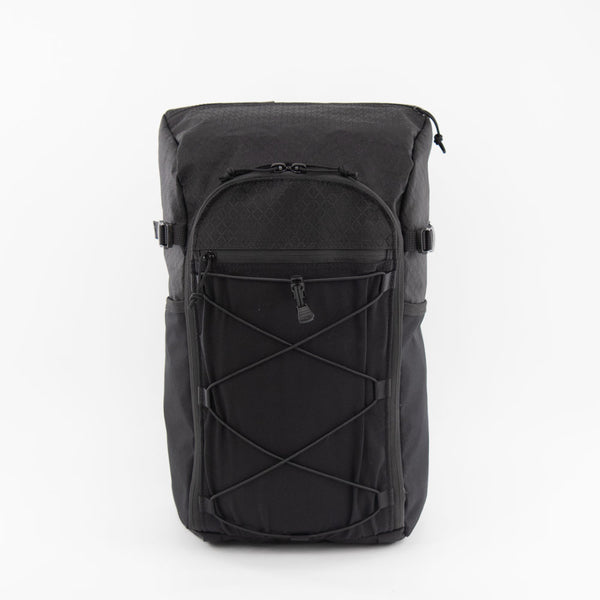 ULA Robic 36L Dragonfly Patchless in black diamond Robic fabric, front studio view with bungee cord pocket