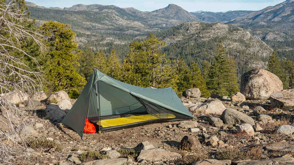 Tarptent ProTrek trekking-pole tent pitched with the door open, gear inside